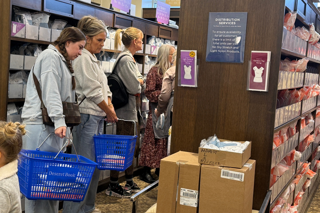 Members of The Church of Jesus Christ of Latter-day Saints shop for new sleeveless sacred garments at Deseret Book in Salt Lake City on Tuesday, Oct. 28, 2025. (AP Photo/Hannah Schoenbaum)