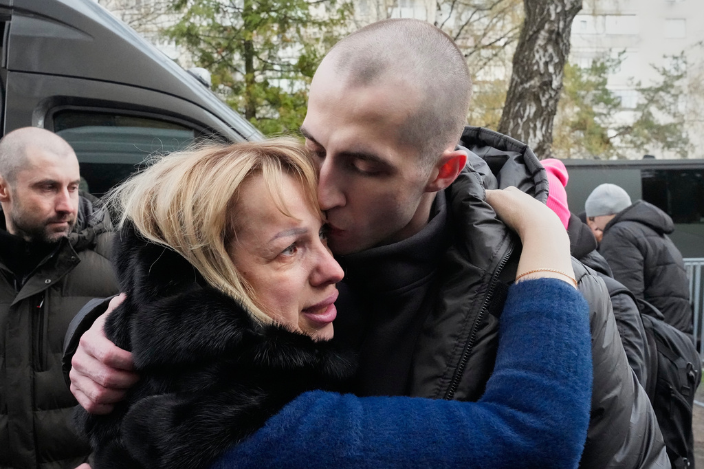 A Ukrainian serviceman hugs his mother after returning from captivity during a POWs exchange between Russia and Ukraine, in Chernyhiv region, Ukraine, Saturday, April 11, 2026. (AP Photo/Efrem Lukatsky)