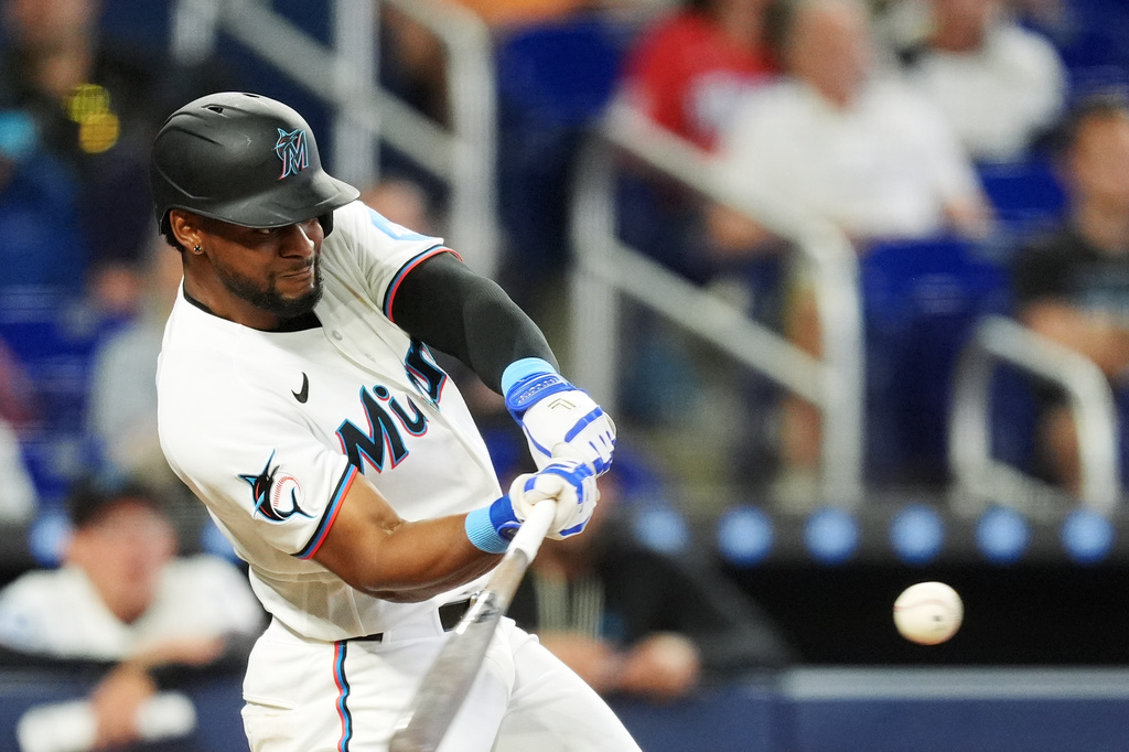 Miami Marlins Otto Lopez hits a home run during the eighth inning of a baseball game against the Chicago White Sox, Wednesday, April 1, 2026, in Miami. (AP Photo/Rebecca Blackwell)