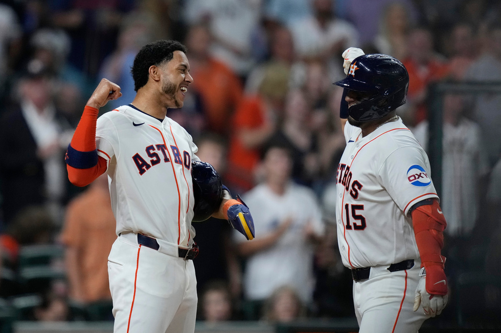 Houston Astros' Isaac Paredes, right, celebrates with Jeremy Peña after hitting a three-run home run during the fifth inning of a baseball game against the Miami Marlins, Tuesday, July 21, 2026, in Houston. (AP Photo/Kevin M. Cox)