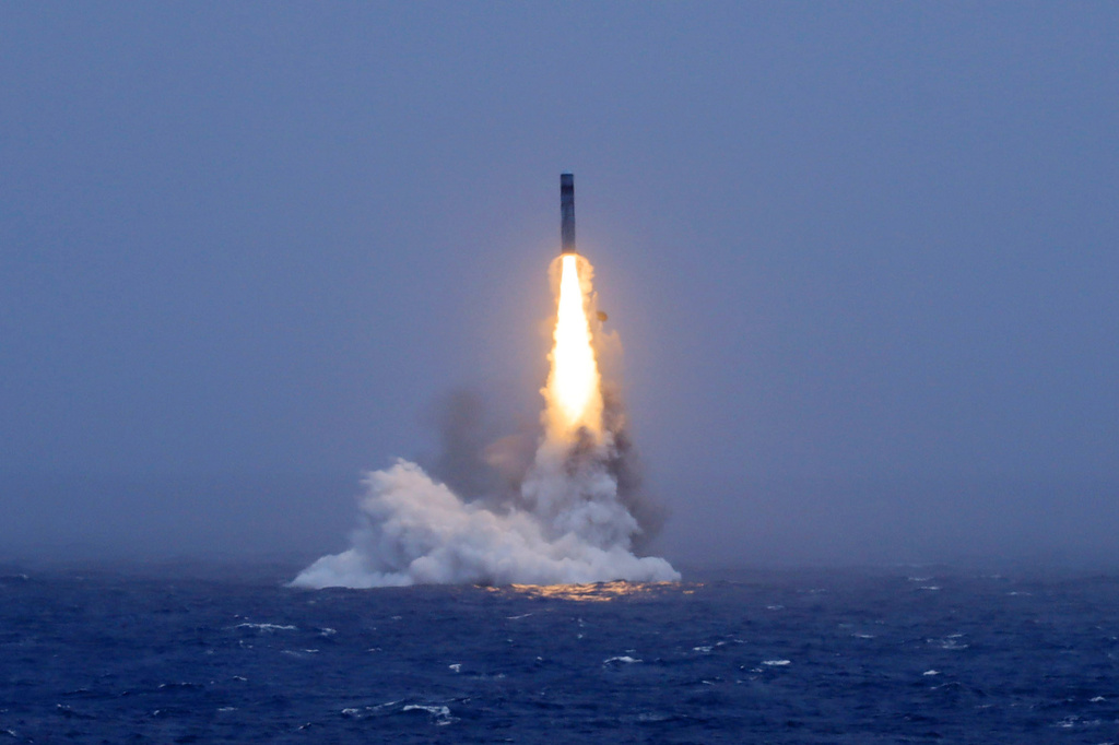 In this photo released by Xinhua News Agency, a long-range ballistic missile bursts out of the sea during a test launched from a Chinese nuclear-powered submarines in the South Pacific on Monday, July 6, 2026. (Li Xiangchao/Xinhua via AP)