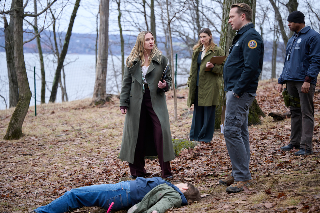 This image released by NBC shows Hope Davis, center, in a scene from "Line of Fire." (Scott Gries/NBC via AP))