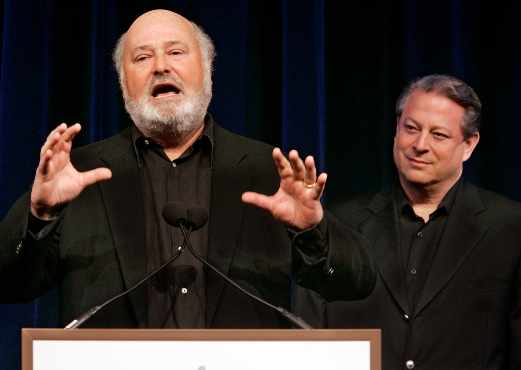 FILE - Former Vice President AL Gore, right, listens as movie director Rob Reiner addresses a Tribeca Film Festival news conference on a series of global warming-themed short films produced by the SOS (Save Our Selves) campaign which opened the festival in a gala hosted by Gore, April 25, 2007, in New York. (AP Photo/Richard Drew, File)