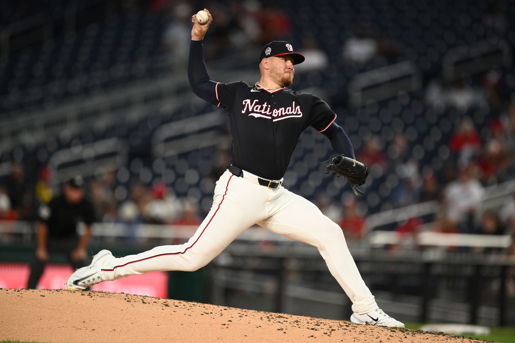 Washington Nationals pitcher Cade Cavalli throws during the third inning of a baseball game against the Los Angeles Angels, Friday, Sept. 11, 2026, in Washington. (AP Photo/Nick Wass)