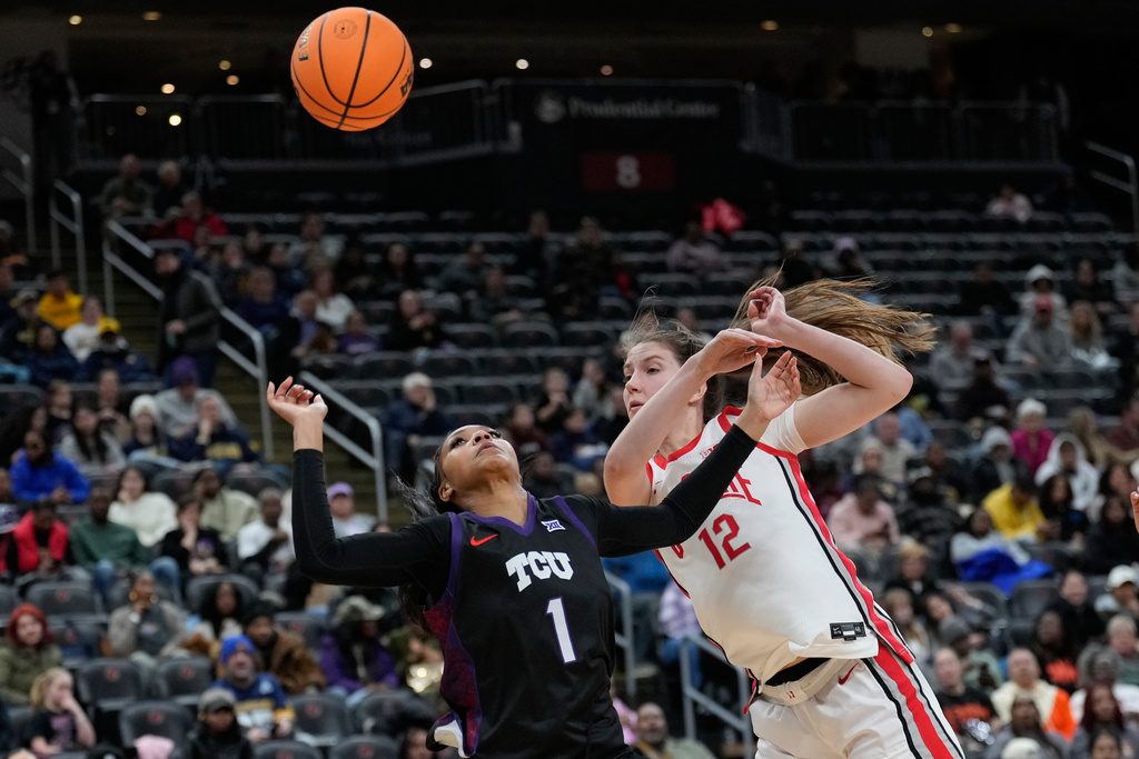 TCU's Taylor Bigby, left, and Ohio State's Elsa Lemmilä fight for the ball during the second half of an NCAA women's college basketball game in Newark, N.J., Monday, Jan. 19, 2026. (AP Photo/Seth Wenig)