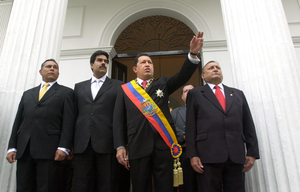 FILE - Venezuelan President Hugo Chavez, center right, is accompanied by President of Congress Nicolas Maduro, center left, before giving his annual speech to Congress in Caracas, Venezuela, Jan. 14, 2005. (AP Photo/Leslie Mazoch, File)