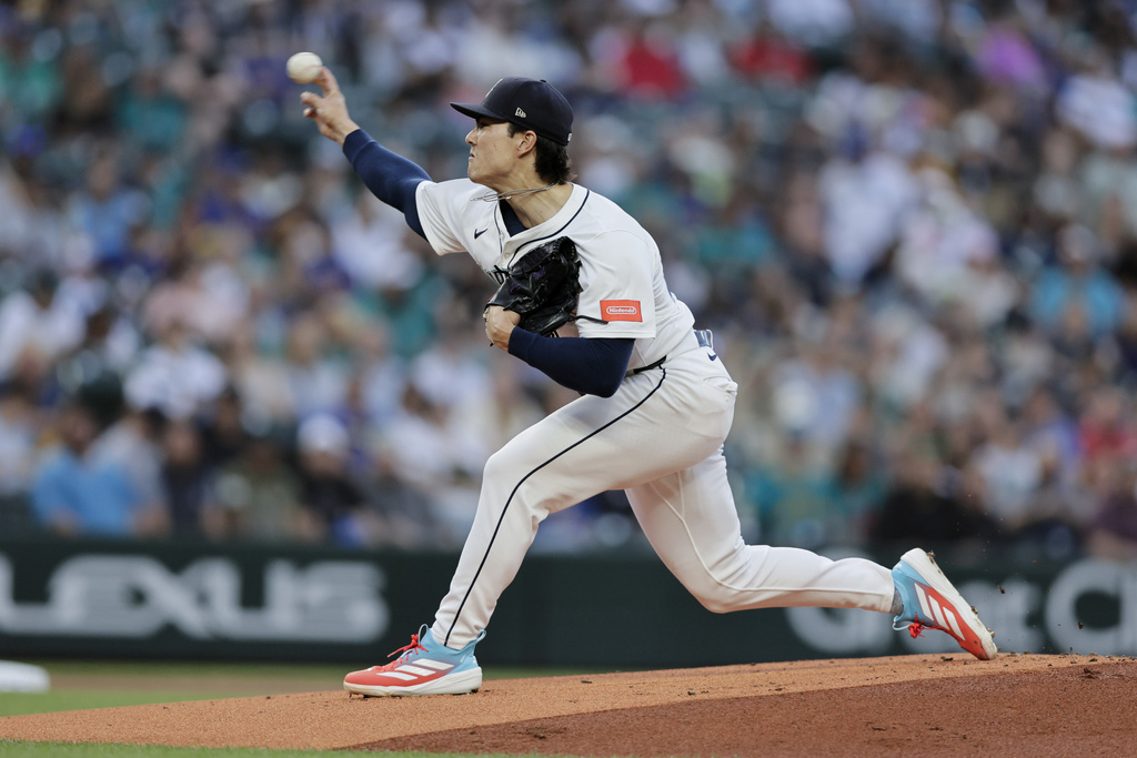 Seattle Mariners starting pitcher Bryan Woo throws against the Los Angeles Angels during the first inning of a baseball game Saturday, Sept. 13, 2025, in Seattle. (AP Photo/John Froschauer)