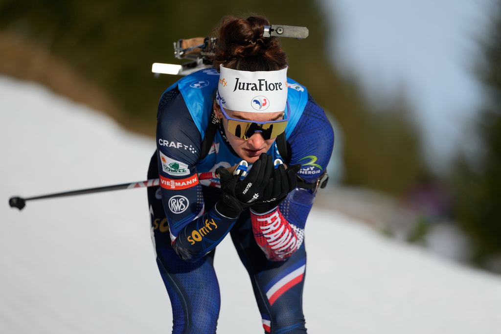 FILE - Lou Jeanmonnot of France competes in the women's 7.5 km sprint competition at the Biathlon World Cup in Hochfilzen, Austria, Dec. 12, 2025. (AP Photo/Matthias Schrader, File)