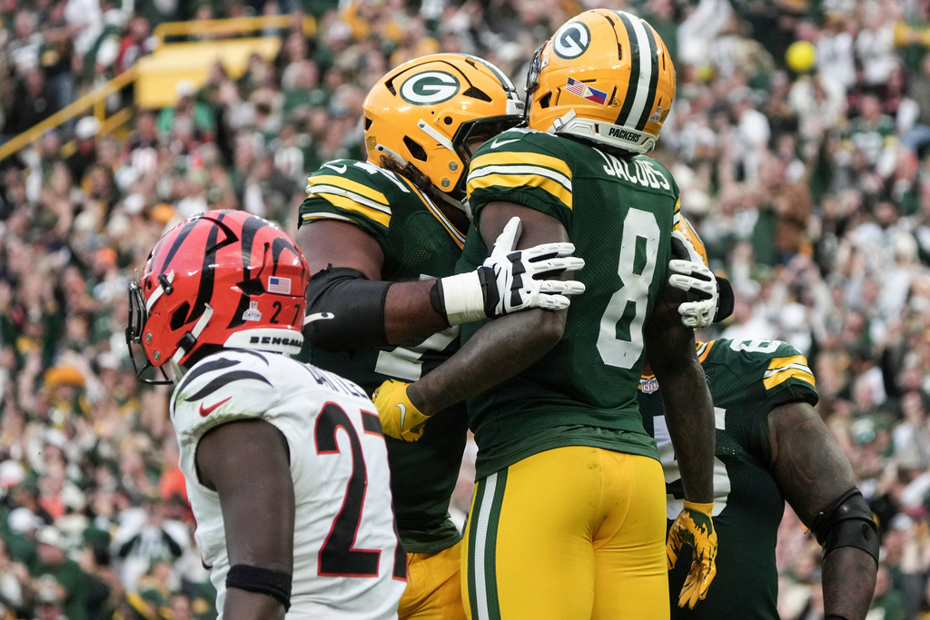 Green Bay Packers running back Josh Jacobs (8) celebrates his touchdown against the Cincinnati Bengals in the second half of an NFL football game, Sunday, Oct. 12, 2025, in Green Bay, Wis. (AP Photo/Morry Gash)