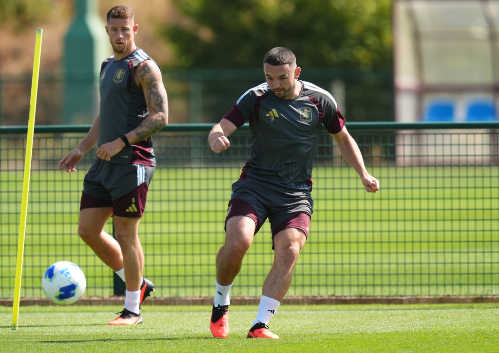 Aston Villa's John McGinn, right, and Ross Barkley attend a training session in Birmingham, England, Tuesday Aug. 11, 2026. (Nick Potts/PA via AP)