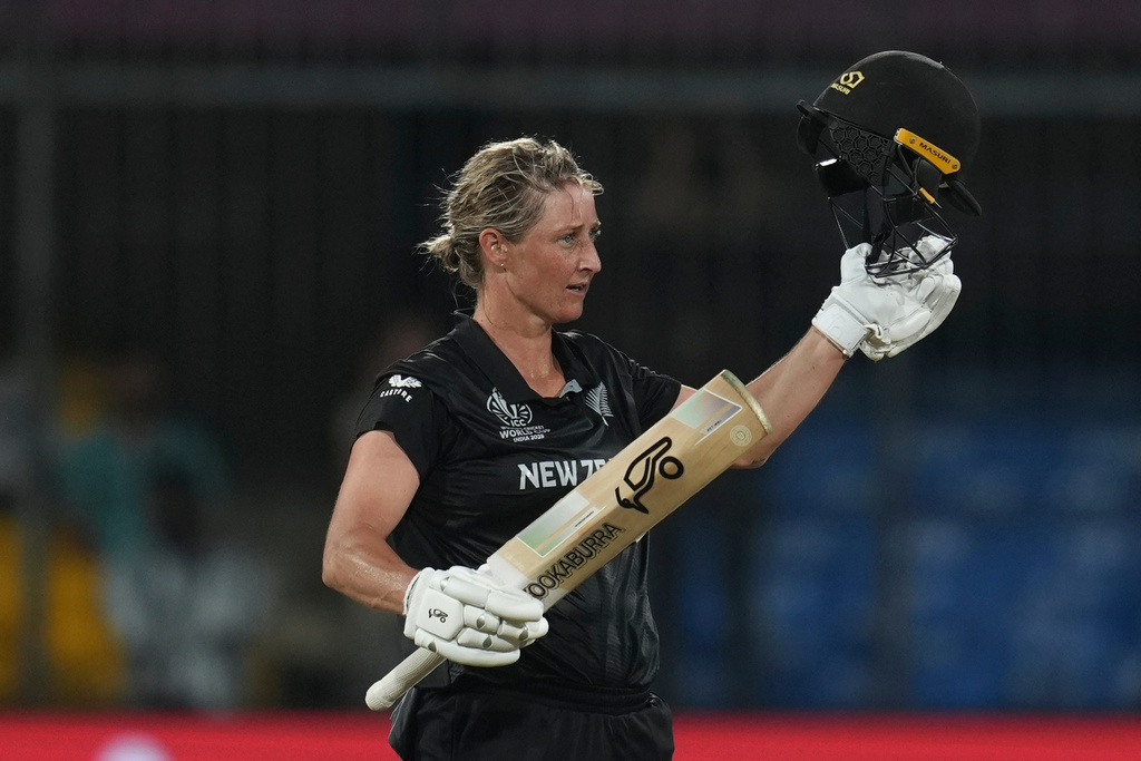 New Zealand's captain Sophie Devine celebrates her century during the ICC Women's Cricket World Cup cricket match between New Zealand and Australia at Holkar Cricket Stadium in Indore, India, Wednesday, Oct. 1, 2025. (AP Photo/Rafiq Maqbool)