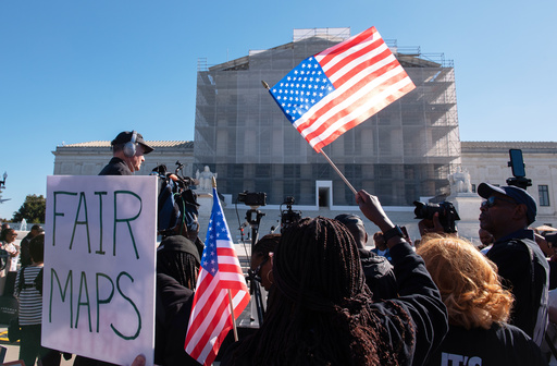 Voting rights activists gather outside the Supreme Court in Washington, early Wednesday, Oct. 15, 2025, as the justices prepare to take up a major Republican-led challenge to the Voting Rights Act, the centerpiece legislation of the Civil Rights Movement. (AP Photo/Cliff Owen) Voting rights activists gather outside the Supreme Court in Washington, early Wednesday, Oct. 15, 2025, as the justices prepare to take up a major Republican-led challenge to the Voting Rights Act, the centerpiece legislation of the Civil Rights Movement. (AP Photo/Cliff Owen)