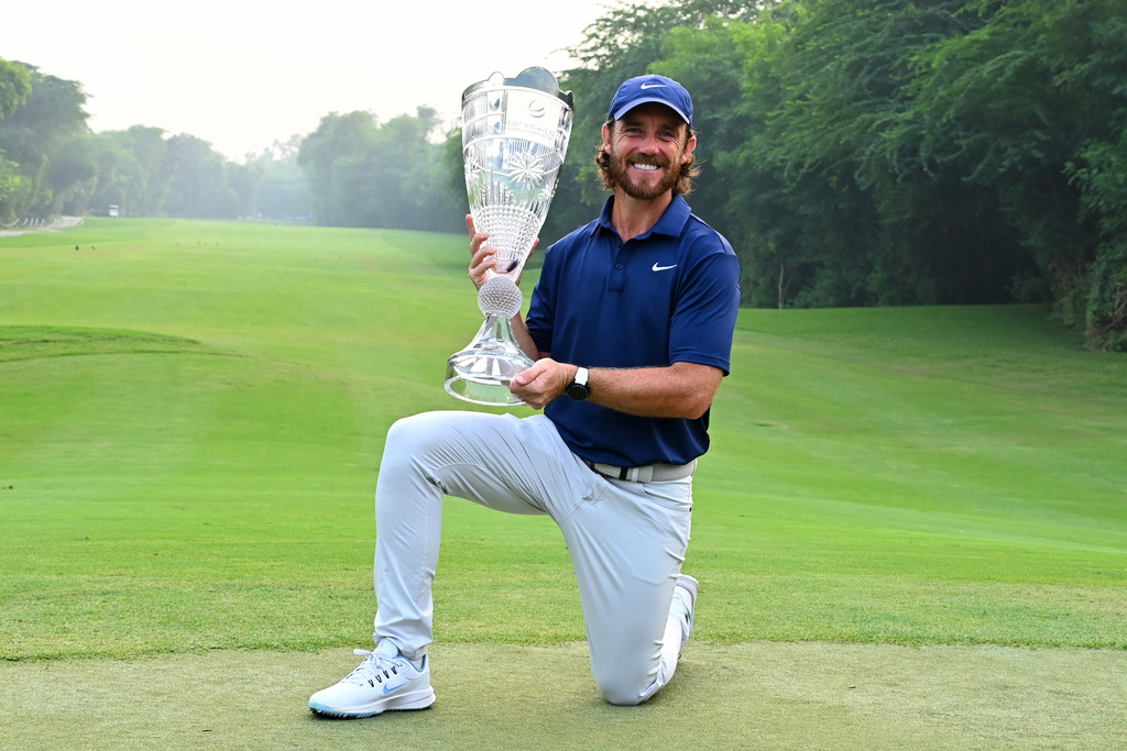 Tommy Fleetwood of England poses with the trophy after wining the DP World Tour Championship golf tournament in New Delhi, India, Sunday, Oct.19, 2025. (AP Photo/Dharam Diwakar)