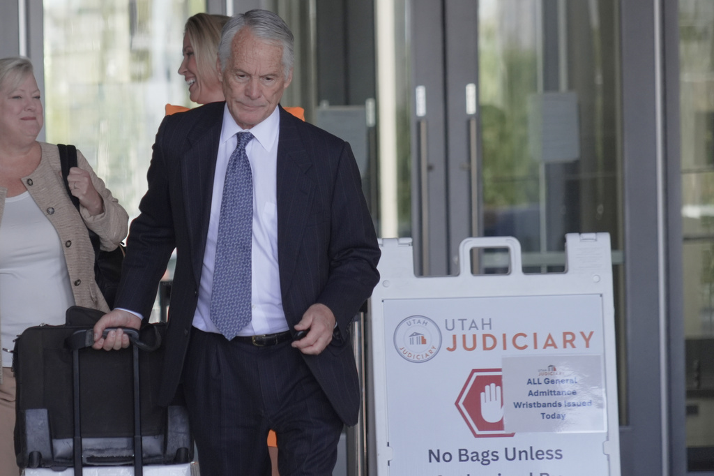 Defense attorney Michael Burt and Kathryn Nester, left, leave the fourth judicial District courthouse where a preliminary hearing for Tyler Robinson, the Utah man accused of fatally shooting Charlie Kirk, took place, in Provo, Utah, Friday, July 10, 2026. (AP Photo/Ty ONeil)