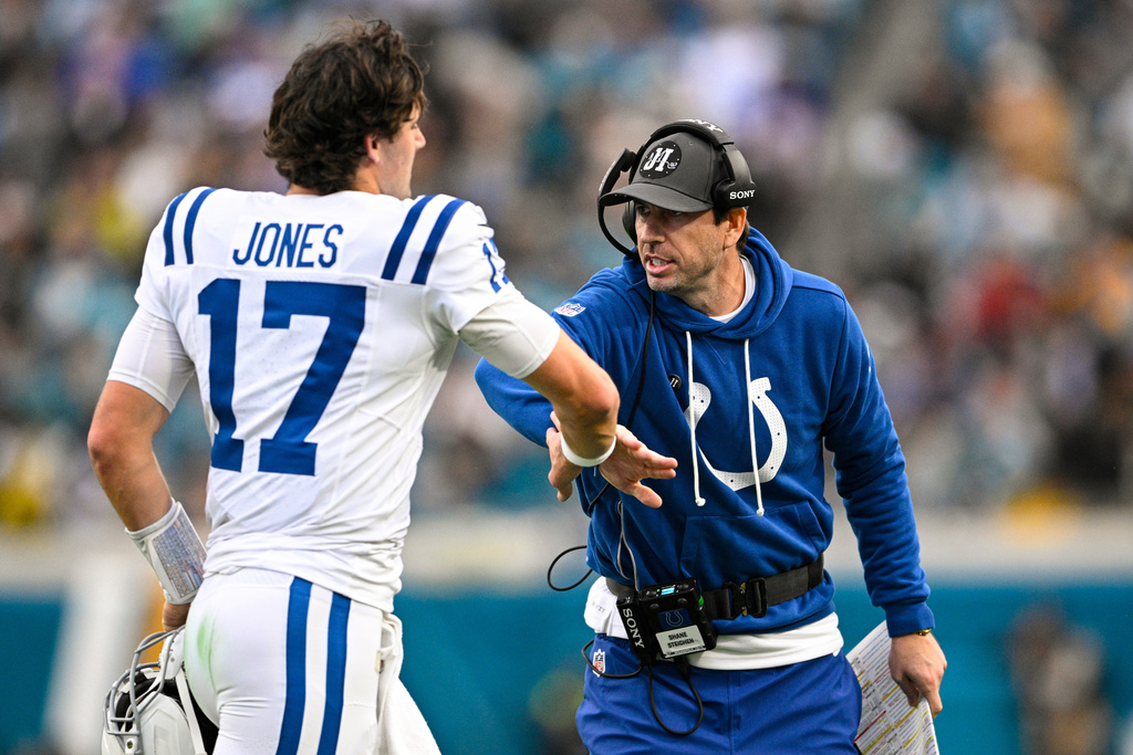 Indianapolis Colts head coach Shane Steichen celebrates a touchdown with quarterback Daniel Jones (17) during the first half of an NFL football game against the Jacksonville Jaguars, Sunday, Dec. 7, 2025, in Jacksonville, Fla. (AP Photo/Phelan M. Ebenhack)
