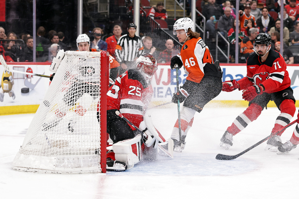 Philadelphia Flyers center Trevor Zegras (46) scores his second goal of the game past New Jersey Devils goaltender Jacob Markstrom during the first period of an NHL hockey game Tuesday, April 7, 2026, in Newark, N.J. (AP Photo/Adam Hunger)