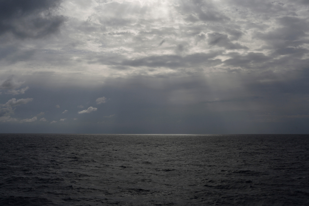 In this photo taken on Sunday, Sept. 8, 2019, the sun shines over international waters north of Libya in the Mediterranean Sea. (AP Photo/Renata Brito)