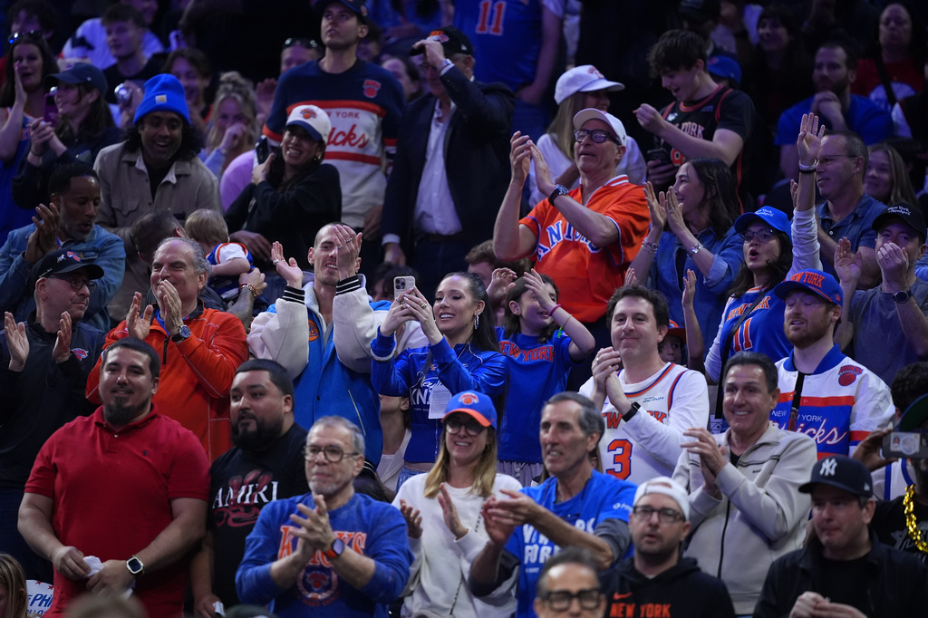 New York Knicks' fans cheer during the first half of Game 4 against the Philadelphia 76ers in a second-round NBA basketball playoffs series Sunday, May 10, 2026, in Philadelphia. (AP Photo/Matt Slocum)