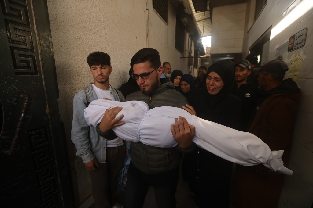 Palestinians mourn over Al-Tanani family killed in an Israeli strike, during their funeral at Al-Shifa Hospital in Gaza City Saturday, April 25, 2026. (AP Photo/Yousef Alzanoun)
