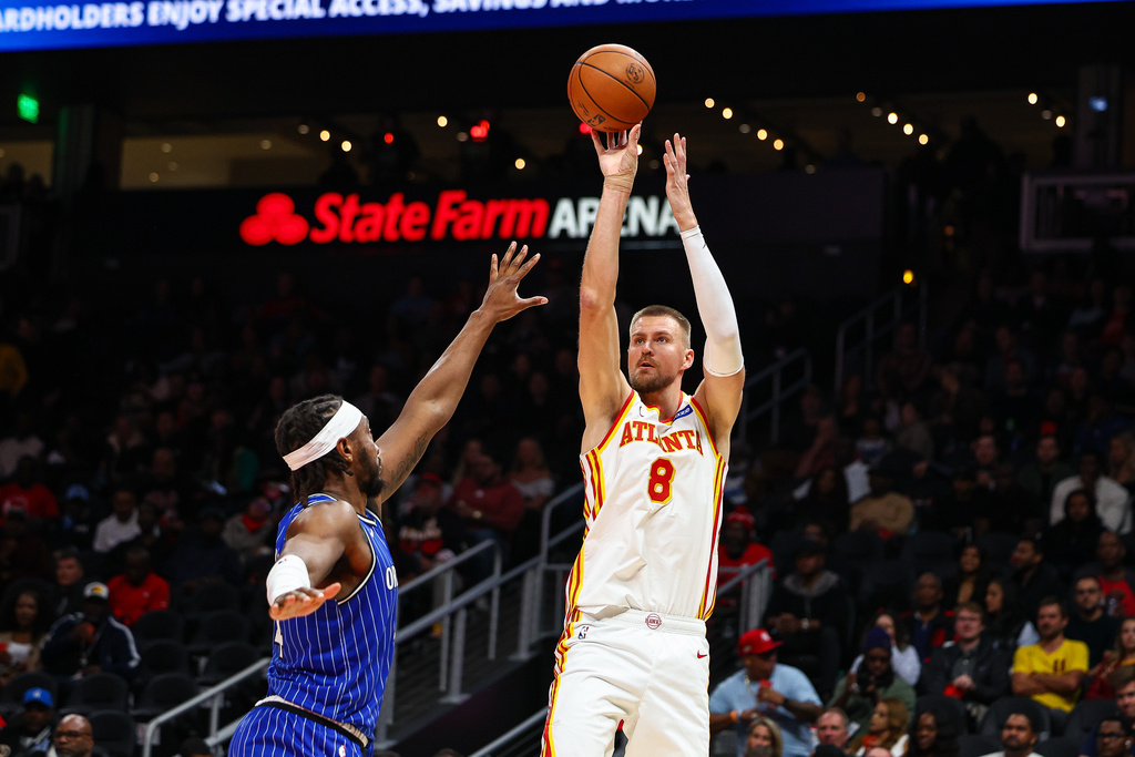 Atlanta Hawks center Kristaps Porzingis (8) shoots the ball during the first half of an NBA basketball game against the Orlando Magic, Tuesday, Nov. 4, 2025, in Atlanta. (AP Photo/Colin Hubbard)
