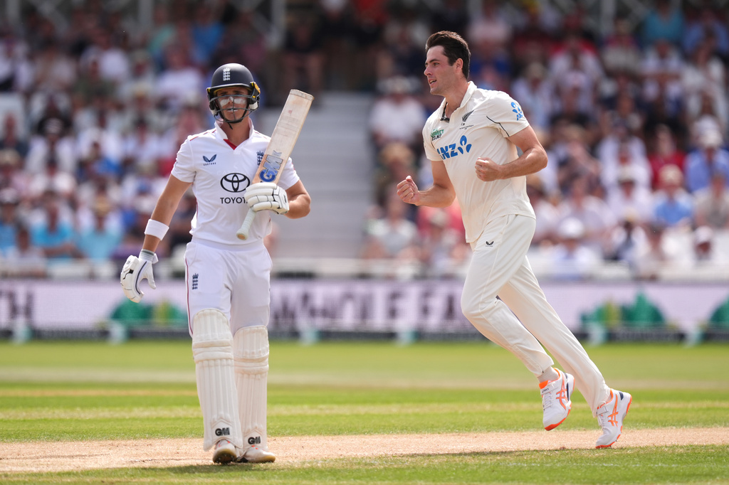 New Zealand's Will O'Rourke, right, celebrates the wicket of England's Jacob Bethell after being caught out by New Zealand's Tom Latham, during day three of the Third Test cricket match between England and New Zealand, in Nottingham, England, Saturday June 27, 2026. (Mike Egerton/PA via AP)