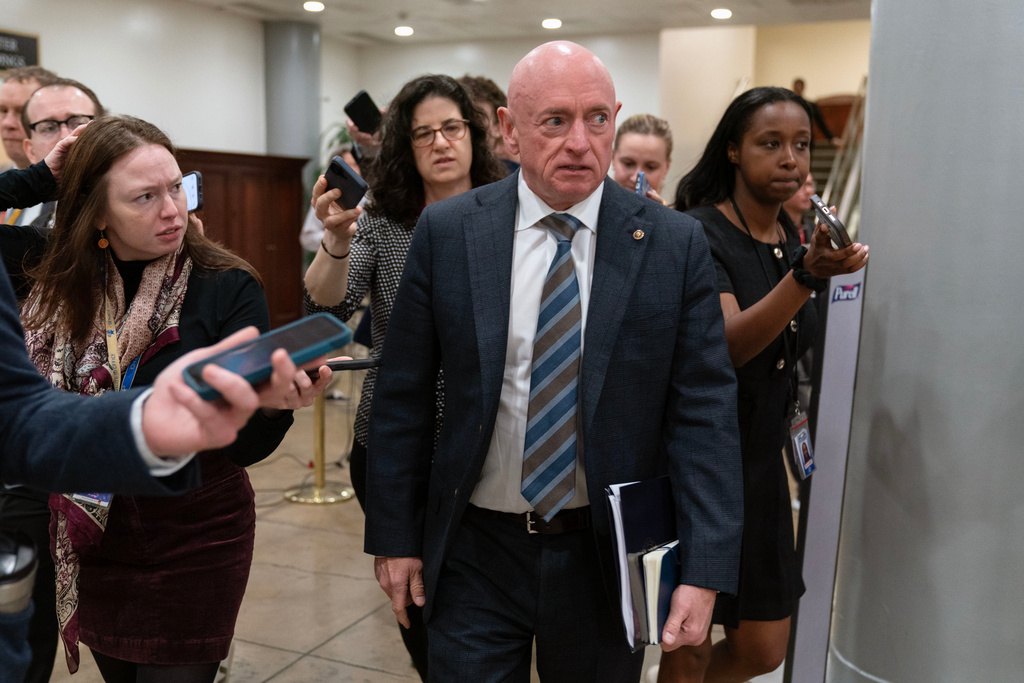 Mark Kelly, D-Ariz., leaves after a closed door briefing on the Iran war before the Senate Armed Services Committee at the Capitol Tuesday, March 10, 2026, in Washington. (AP Photo/Jose Luis Magana)