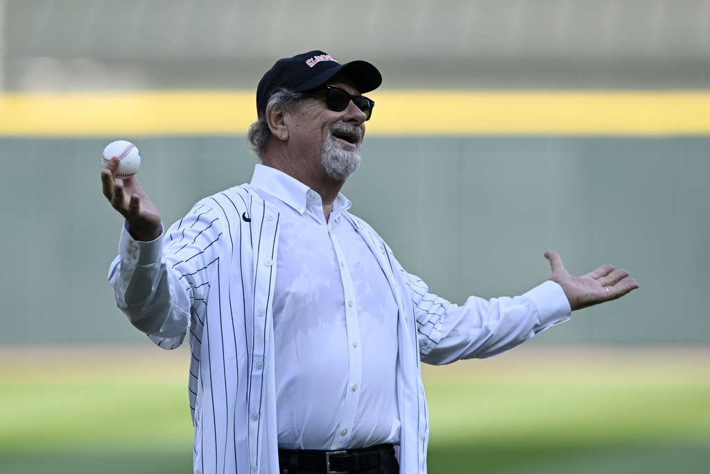 Former Chicago White Sox owner Bill Veeck's son Mike reacts after being announced before throwing out the ceremonial first pitch before a baseball game between the Chicago White Sox and the Cleveland Guardians at Rate Field Saturday, Aug. 9, 2025, in Chicago. (AP Photo/Paul Beaty)