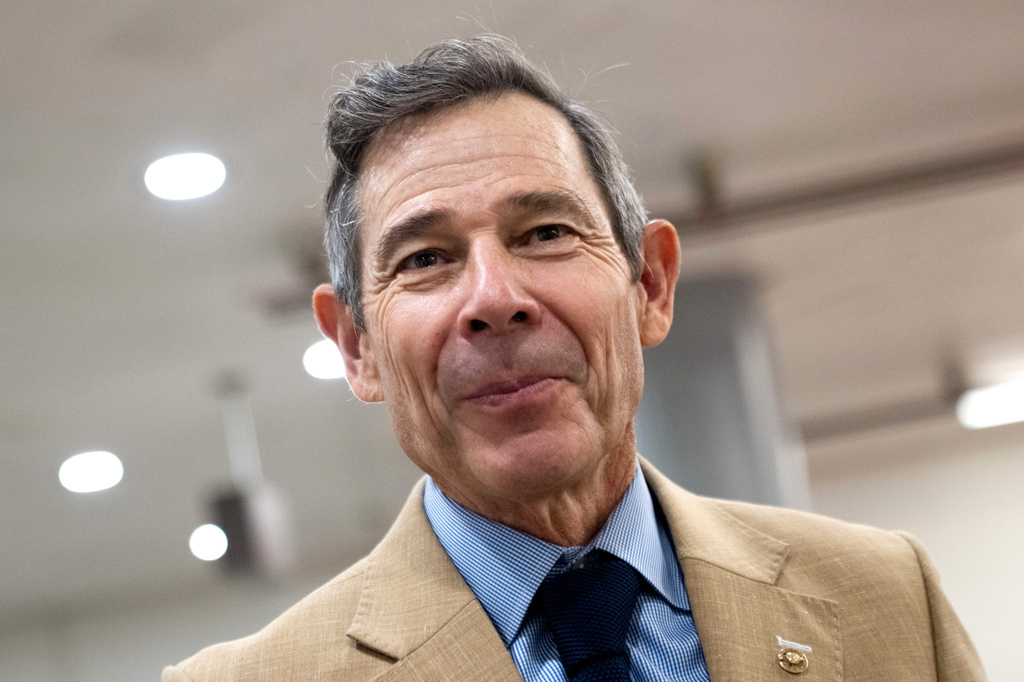 FILE - Sen. John Curtis, R-Utah, walks through the Capitol during votes in Washington, July 16, 2026. (AP Photo/Allison Robbert, File)