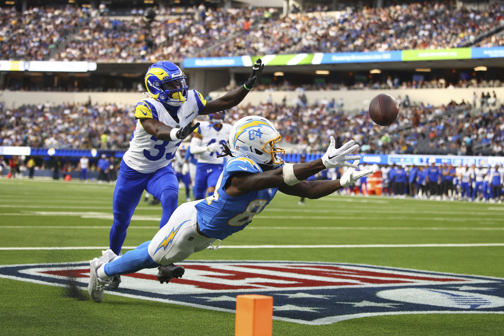 Los Angeles Chargers wide receiver KeAndre Lambert-Smith (84) cannot catch a pass in the end zone in front of Los Angeles Rams cornerback Cam Lampkin (33) during the first half of an NFL preseason football game, Saturday, Aug. 16, 2025, in Inglewood, Calif. (AP Photo/Jessie Alcheh)