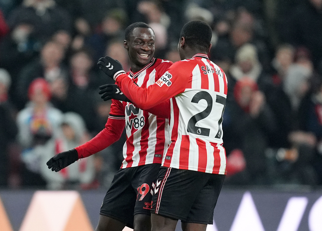 Sunderland's Habib Diarra, left, celebrates scoring his team's second goal against Burnley at the Stadium of Light in Sunderland, Monday, Feb. 2, 2026. (Martin Rickett/PA via AP)