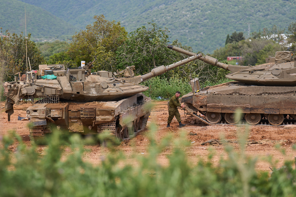 An Israeli soldier works on tanks in northern Israel, on the border with Lebanon following a ceasefire between Israel and Hezbollah, Friday, April 17, 2026. (AP Photo/Ariel Schalit)