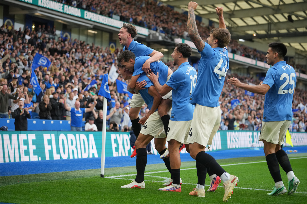 Brighton players celebrate after third goal during the English Premier League soccer match between Brighton & Hove Albion and Arsenal in Brighton, England, Saturday, Sept. 19, 2026. (AP Photo/Kin Cheung)
