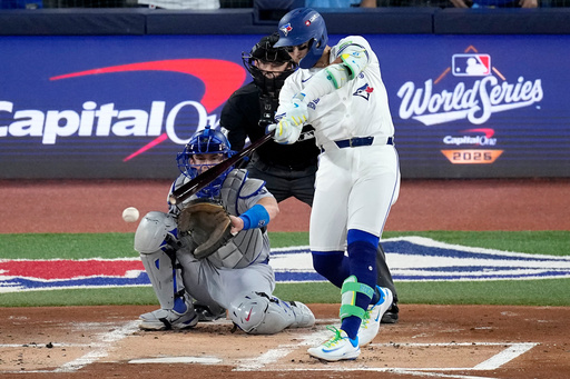 Toronto Blue Jays' Bo Bichette connects for a base hit against the Los Angeles Dodgers during the first inning in Game 1 of baseball's World Series, Friday, Oct. 24, 2025, in Toronto. (AP Photo/David J. Phillip) Toronto Blue Jays' Bo Bichette connects for a base hit against the Los Angeles Dodgers during the first inning in Game 1 of baseball's World Series, Friday, Oct. 24, 2025, in Toronto. (AP Photo/David J. Phillip)