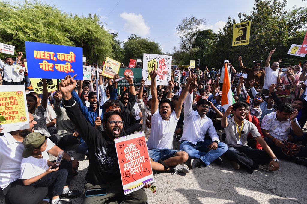 Protesters shout slogans during a nationwide protest campaign launched by Abhijeet Dipke, founder of the Cockroach Janta Party, in Pune, India, Thursday, June 11, 2026. (AP Photo/Mahendra Kolhe)