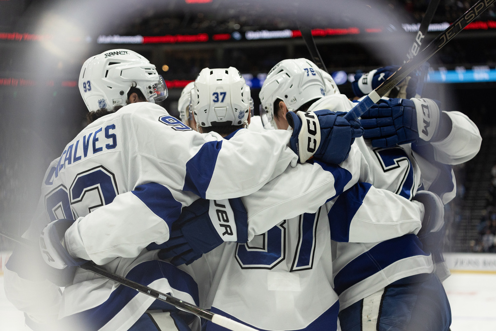 Tampa Bay Lightning players celebrate after a goal against the Utah Mammoth during the first period of an NHL hockey game Sunday, Nov. 2, 2025, in Salt Lake City. (AP Photo/Melissa Majchrzak)