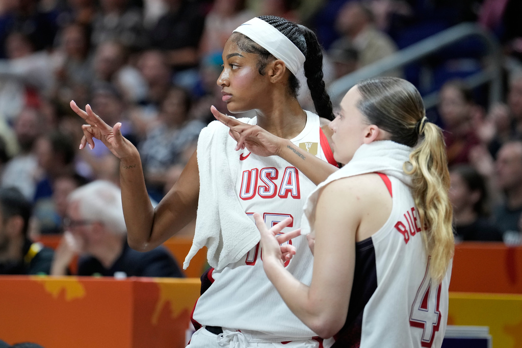 Angel Reese, of the United States, left, and Paige Bueckers, react during the Women's Basketball World Cup quarterfinal match between the United States and Hungary in Berlin, Thursday, Sept. 10, 2026. (AP Photo/Ebrahim Noroozi)