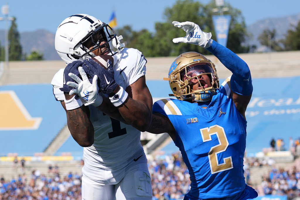 Penn State wide receiver Kyron Hudson (1) makes a touchdown catch past UCLA defensive back Andre Jordan Jr. during the second half of an NCAA college football game Saturday, Oct. 4, 2025, in Pasadena, Calif. (AP Photo/Marcio Jose Sanchez)