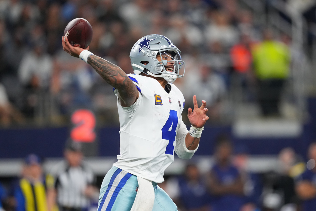 Dallas Cowboys quarterback Dak Prescott throws a pass during the first half of an NFL football game against the Minnesota Vikings Sunday, Dec. 14, 2025, in Arlington, Texas. (AP Photo/Julio Cortez)