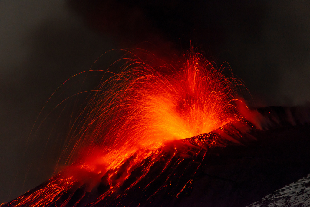 Explosive activity concentrates at the north-east crater of the Mount Etna, as an eruption started on Dec. 24 continues, in Sicily, Italy, Monday Dec. 29, 2025. (AP Photo/Salvatore Allegra)