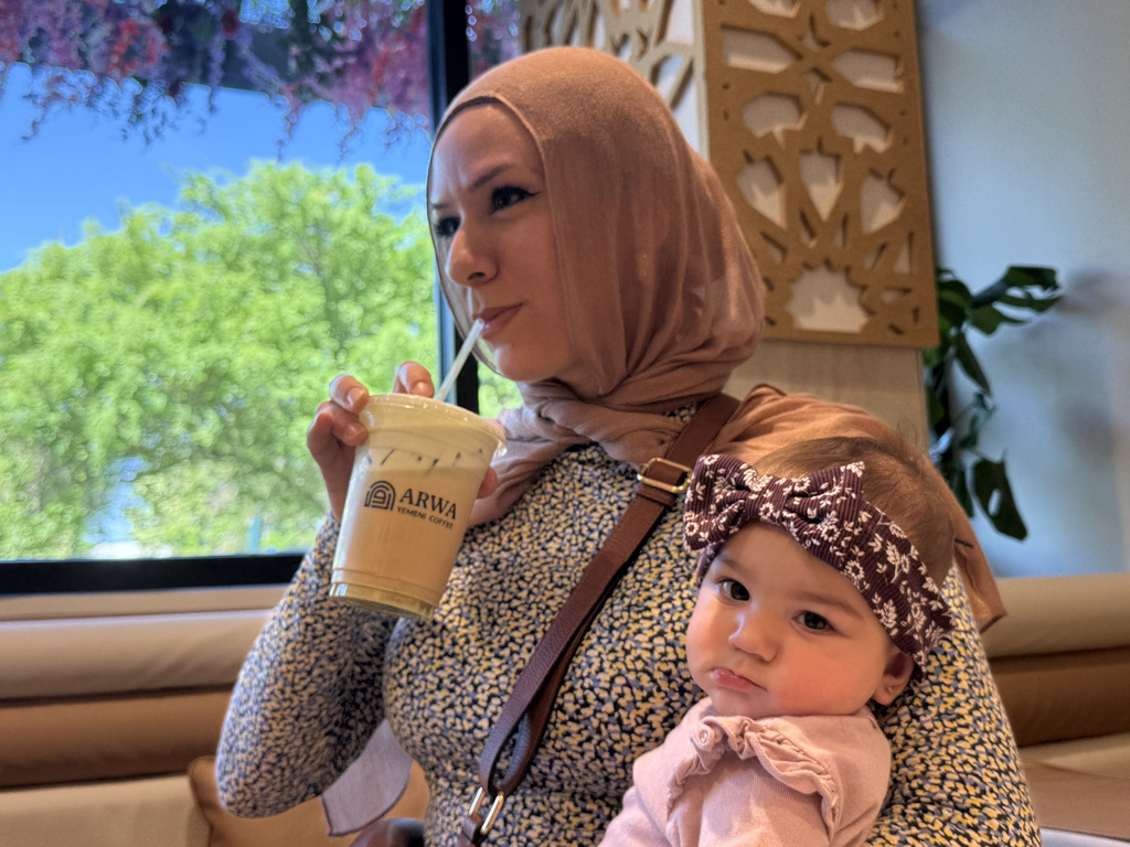 Hanan Jomaa drinks an iced pistachio latte inside Arwa Yemeni Coffee on April 6, 2026 in Sunnyvale, Calf. (AP Photo/Haven Daley)