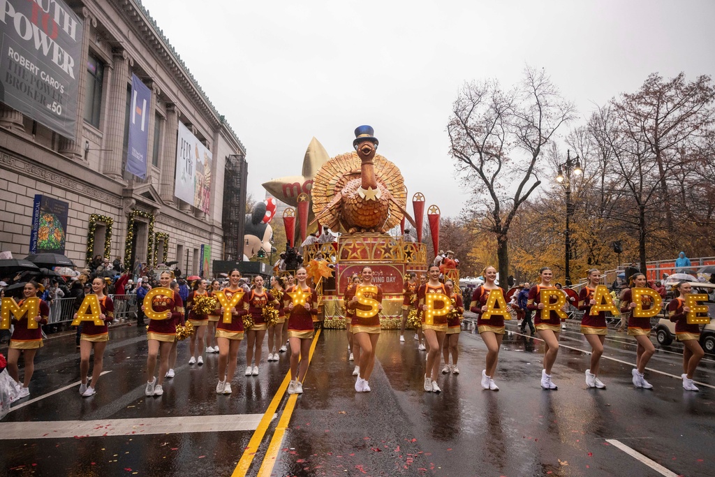 FILE - Parade performers lead the Tom Turkey float down Central Park West at the start of the Macy's Thanksgiving Day parade in New York on Nov. 28 2024. (AP Photo/Yuki Iwamura, File)