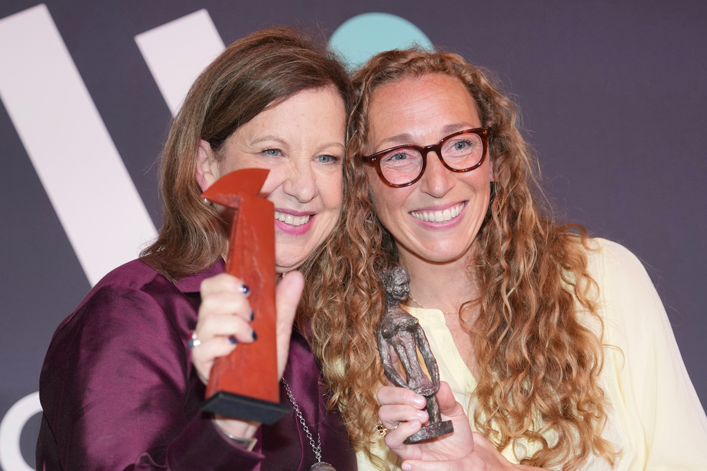 Virginia Evans, right, and Lyse Doucet winners of The Women's Prize for fiction and nonfiction, left, pose for a photograph at the 2026 Women's Prize Trust Summer Party & Awards Ceremony in London, Thursday, June 11, 2026. (AP Photo/Kin Cheung)