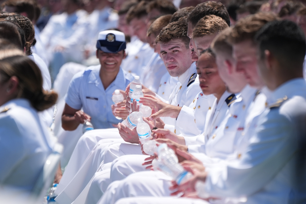 U.S. Coast Guard Academy Cadets endure the heat as President Donald Trump speaks during the commencement address at the U.S. Coast Guard Academy, in New London, Conn., Wednesday, May 20, 2026. (AP Photo/Jacquelyn Martin)