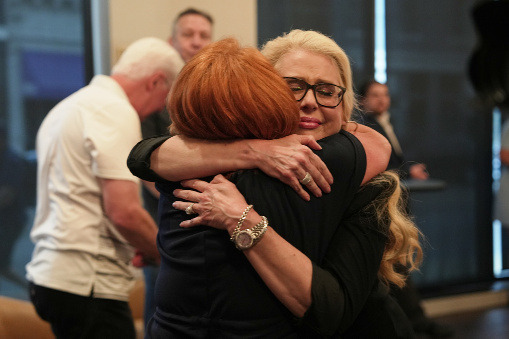 Supporters hug after Republican congressional candidate Ed Gallrein won the party's nomination during an election night event Tuesday, May 19, 2026, in Covington, Ky. (AP Photo/Joshua A. Bickel)