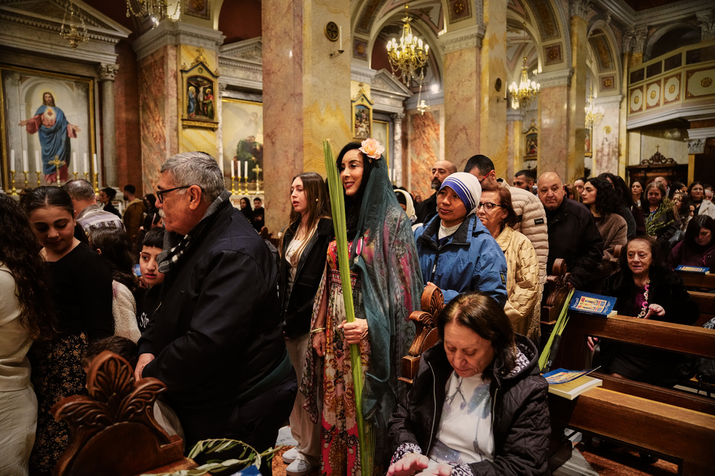 Catholic faithfuls attend a Palm Sunday mass at the Monastery of Saint Saviour in Jerusalem's Old City Sunday, March 29, 2026. (AP Photo/Mahmoud Illean)