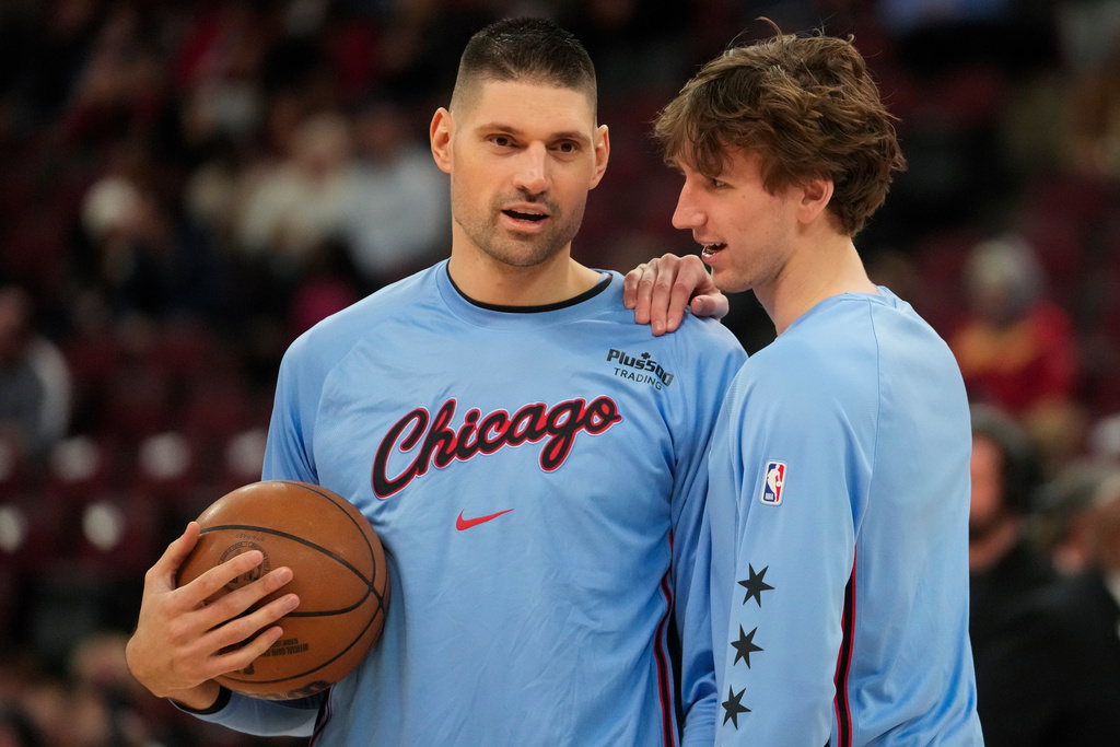 Chicago Bulls center Nikola Vucevic, left, and forward Matas Buzelis warm up before an NBA basketball game against the Miami Heat, Thursday, Jan. 29, 2026, in Chicago. (AP Photo/Erin Hooley)