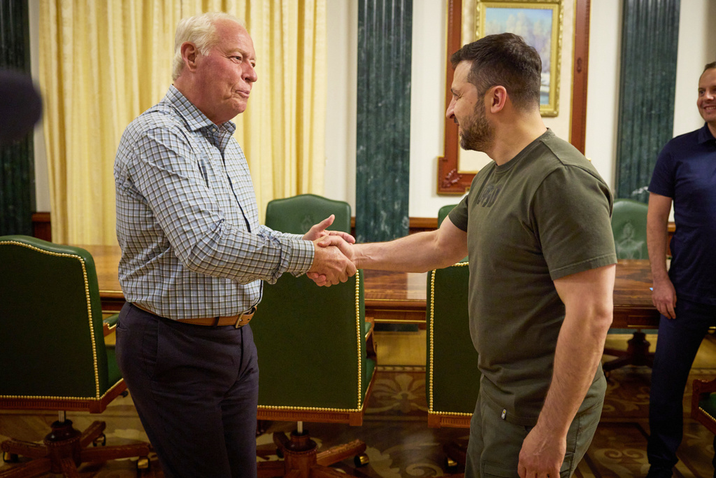 In this photo provided by the Press Service of The President of Ukraine on June 30, 2024, Dell Loy Hansen, a Utah real estate developer, left, shakes hands with Ukraine's President Volodymyr Zelenskyy in Kyiv, Ukraine. (Press Service of The President of Ukraine via AP)