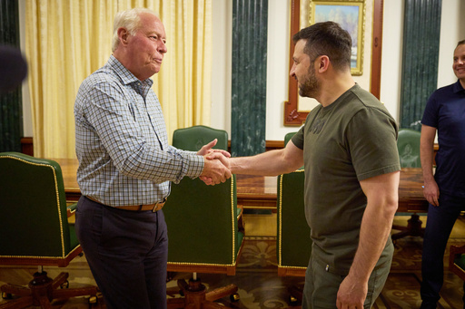 In this photo provided by the Press Service of The President of Ukraine on June 30, 2024, Dell Loy Hansen, a Utah real estate developer, left, shakes hands with Ukraine's President Volodymyr Zelenskyy in Kyiv, Ukraine. (Press Service of The President of Ukraine via AP) In this photo provided by the Press Service of The President of Ukraine on June 30, 2024, Dell Loy Hansen, a Utah real estate developer, left, shakes hands with Ukraine's President Volodymyr Zelenskyy in Kyiv, Ukraine. (Press Service of The President of Ukraine via AP)