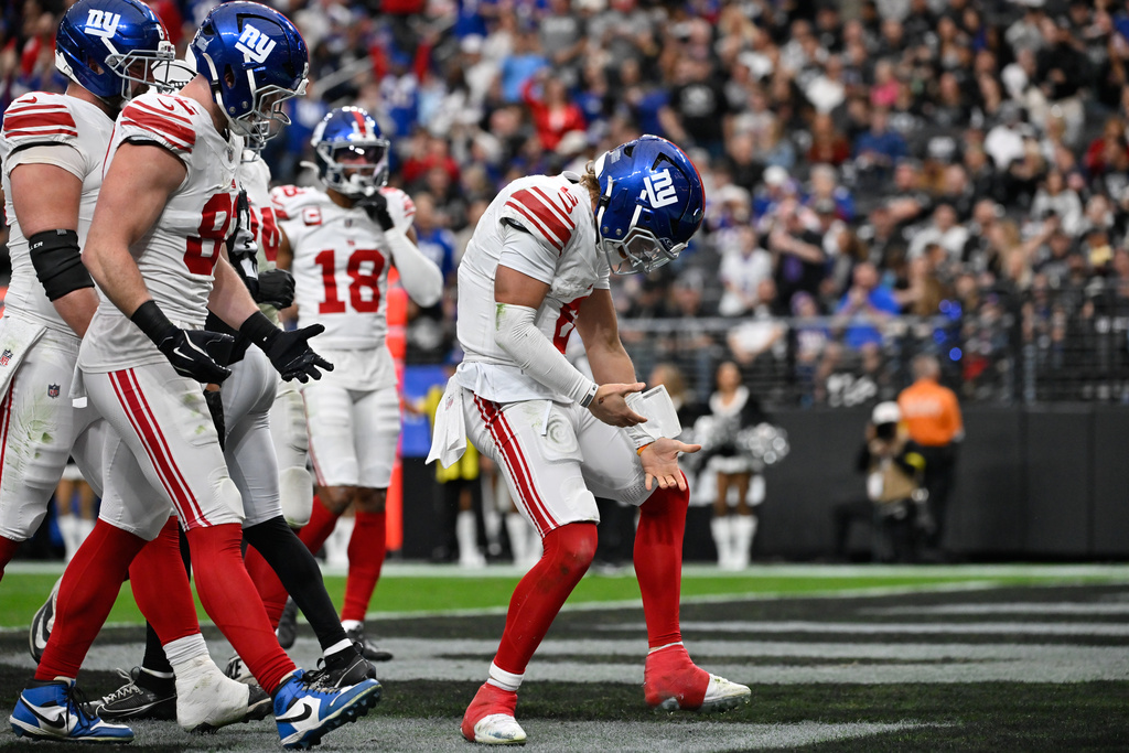New York Giants quarterback Jaxson Dart (6) celebrates his touchdown during the first half of an NFL football game against the Las Vegas Raiders Sunday, Dec. 28, 2025, in Las Vegas. (AP Photo/David Becker)