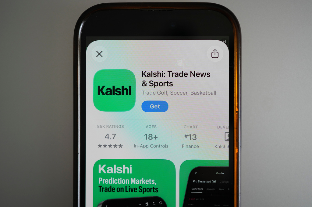 FILE - An ad for the prediction market app Kalshi is displayed on a mobile phone on April 16, 2026, in Chicago. (AP Photo/Erin Hooley, File)